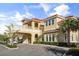 Elegant exterior view showcasing the building's architectural design and well-manicured landscaping at 2710 Bolzano Dr, Apopka, FL 32712