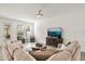 Bright and airy living room with large windows, neutral tones, and comfortable seating at 2710 Bolzano Dr, Apopka, FL 32712