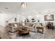 Open-concept living room connected to the kitchen and dining area with cozy seating at 2710 Bolzano Dr, Apopka, FL 32712