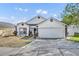 Charming single-story home featuring a two-car garage and well-maintained landscaping at 280 Bay St, Apopka, FL 32712