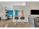 Kitchen and dining area featuring bar seating with hardwood floors at 280 Bay St, Apopka, FL 32712