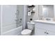 Well-lit bathroom with a tub, shower, and modern fixtures at 2903 Canary Ave, Davenport, FL 33837