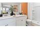 Well-appointed bathroom featuring double sinks, modern decor, and a stylish shower at 2903 Canary Ave, Davenport, FL 33837