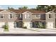 Charming townhome with a two-car garage and lush tropical landscaping at 2903 Canary Ave, Davenport, FL 33837