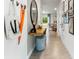Stylish entryway featuring a console table, decorative mirror, and tiled flooring at 2903 Canary Ave, Davenport, FL 33837