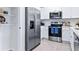 Well-equipped kitchen with stainless steel appliances and nearby pantry storage at 2903 Canary Ave, Davenport, FL 33837