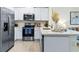 Contemporary kitchen featuring stainless steel appliances, ample counter space and décor at 2903 Canary Ave, Davenport, FL 33837