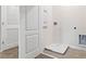 Clean laundry room featuring new appliances, ample space, and a neutral color scheme, offering practicality at 2903 Canary Ave, Davenport, FL 33837