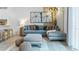 Cozy living room featuring comfortable seating, a stylish rug, and natural light throughout at 2903 Canary Ave, Davenport, FL 33837