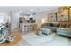 Open concept living room and kitchen with bar stool seating, decorative rug, and modern furnishings at 2903 Canary Ave, Davenport, FL 33837