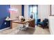 Modern office featuring a unique wooden desk, comfortable seating, and stylish decor at 2903 Canary Ave, Davenport, FL 33837