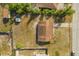 Birds eye view of a well-maintained home showing the roof and backyard with an overview of the surrounding neighborhood at 3166 Canby Dr, Deltona, FL 32738