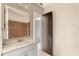 Bathroom features single sink vanity, large mirror and tiled shower at 3166 Canby Dr, Deltona, FL 32738