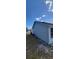 Shows side of home with modern siding and well-maintained landscaping at 3166 Canby Dr, Deltona, FL 32738