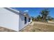 Charming exterior view of the white home with horizontal siding and contrasting dark-framed windows at 3166 Canby Dr, Deltona, FL 32738