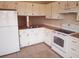 Well-equipped kitchen featuring a refrigerator, oven, and ample cabinet space at 3166 Canby Dr, Deltona, FL 32738