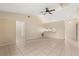 Spacious living room featuring tile flooring and a ceiling fan for added comfort at 3166 Canby Dr, Deltona, FL 32738