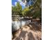 Spacious backyard with mature trees and privacy fence, offering a tranquil outdoor space at 3219 Chariot Pl, Orlando, FL 32818
