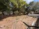 Expansive backyard surrounded by mature trees and featuring a shed for extra storage at 3219 Chariot Pl, Orlando, FL 32818
