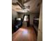 Bedroom with wood flooring, bunk bed, a window with curtain, and a television at 3219 Chariot Pl, Orlando, FL 32818