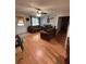 Cozy living room with wood flooring and comfortable seating furniture at 3219 Chariot Pl, Orlando, FL 32818