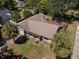 Aerial view of home showcasing roof, landscaping, and surrounding trees at 3220 Cardigan Ct, Orlando, FL 32812