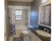 Bathroom with shower-tub combo, granite countertops, and modern fixtures at 3220 Cardigan Ct, Orlando, FL 32812
