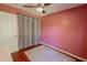 Bedroom with a ceiling fan, window, wood floor, and curtain at 3220 Cardigan Ct, Orlando, FL 32812