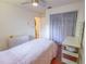 Bedroom with wood floors, a window, and a ceiling fan at 3220 Cardigan Ct, Orlando, FL 32812