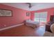 This bedroom features an inviting atmosphere, a window with natural light, and stylish flooring at 3220 Cardigan Ct, Orlando, FL 32812