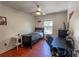 This bedroom features stylish flooring, a ceiling fan, and a window for natural light at 3220 Cardigan Ct, Orlando, FL 32812