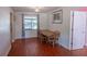 Inviting dining area with hardwood floors, natural light, and a view to the next room at 3220 Cardigan Ct, Orlando, FL 32812