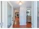 Inviting entryway with hardwood floors, a decorative glass door, and elegant decor at 3220 Cardigan Ct, Orlando, FL 32812