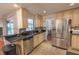 Charming kitchen with stainless steel appliances, and black countertops, offering a functional and stylish cooking space at 3220 Cardigan Ct, Orlando, FL 32812