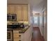 Well-equipped kitchen with stainless steel appliances, granite countertops, and ample cabinet space at 3220 Cardigan Ct, Orlando, FL 32812