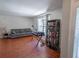 Cozy living room with hardwood floors, a large window, and comfortable seating at 3220 Cardigan Ct, Orlando, FL 32812
