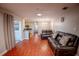 Spacious living area with access to the kitchen and a cozy seating arrangement, ideal for modern living at 3220 Cardigan Ct, Orlando, FL 32812