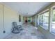 Relaxing screened porch with tiled floor, providing a tranquil space for outdoor enjoyment at 3220 Cardigan Ct, Orlando, FL 32812