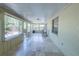 Enclosed porch with tile flooring and natural light, ideal for a comfortable lounging area at 3220 Cardigan Ct, Orlando, FL 32812
