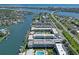 Aerial view of waterfront condos, boat docks, pool and lush landscaping at 325 N Causeway # D-206, New Smyrna Beach, FL 32169