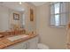 Cozy bathroom featuring a granite countertop and modern fixtures at 325 N Causeway # D-206, New Smyrna Beach, FL 32169