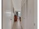 Inviting hallway with closet leading into a bedroom featuring natural light from a window at 325 N Causeway # D-206, New Smyrna Beach, FL 32169