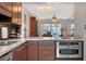 Open-concept kitchen with an oven and views to the living room at 325 N Causeway # D-206, New Smyrna Beach, FL 32169