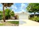 Charming single-Gathering home with a two-car garage and a beautifully landscaped front yard at 329 Kantor Blvd, Casselberry, FL 32707