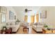 Bright living room with light-colored furniture, hardwood floors, and lots of natural light at 329 Kantor Blvd, Casselberry, FL 32707