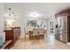 Bright and spacious dining area features tile flooring, modern lighting, and stainless steel refrigerator at 3425 N Westmoreland Dr, Orlando, FL 32804