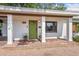 Charming home featuring a welcoming covered porch with brick pavers and a vibrant green front door at 3425 N Westmoreland Dr, Orlando, FL 32804