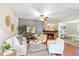 Cozy living room with a brick fireplace, comfortable seating, and stylish decor creates a relaxing ambiance at 3425 N Westmoreland Dr, Orlando, FL 32804
