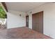 Outdoor patio with brick flooring, white stucco walls, and backyard access at 3425 N Westmoreland Dr, Orlando, FL 32804
