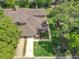 Aerial view of home showcasing mature trees, a long driveway, and manicured lawn at 419 Newton Pl, Longwood, FL 32779